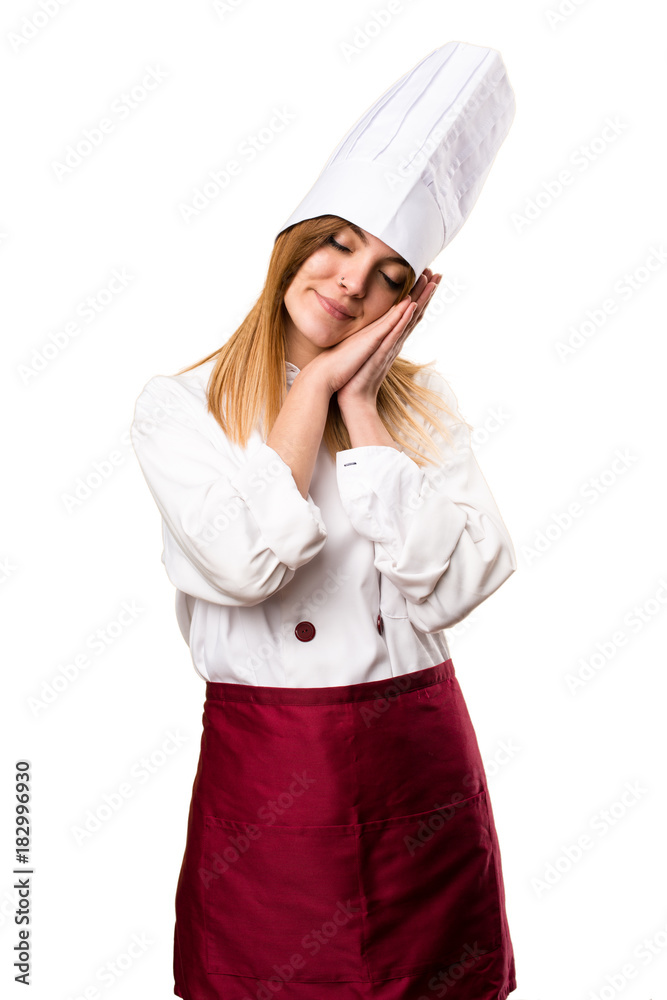 Beautiful chef woman making sleep gesture Beautiful chef woman making sleep gesture