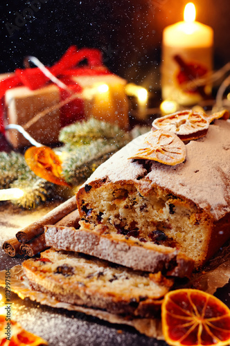 Christmas fruitcake with festive decirations. Falling snowflakes photo