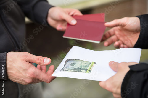 Human Hand Buying Illegal Foreign Passport