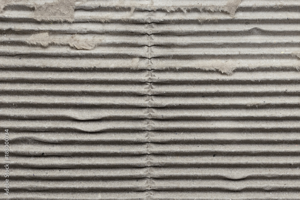 Gray striped old corrugated cardboard, background Gray striped old corrugated cardboard, background