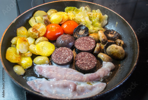 Frying Breakfast with Black Pudding, Bacon, Mushrooms and Potatoes photo