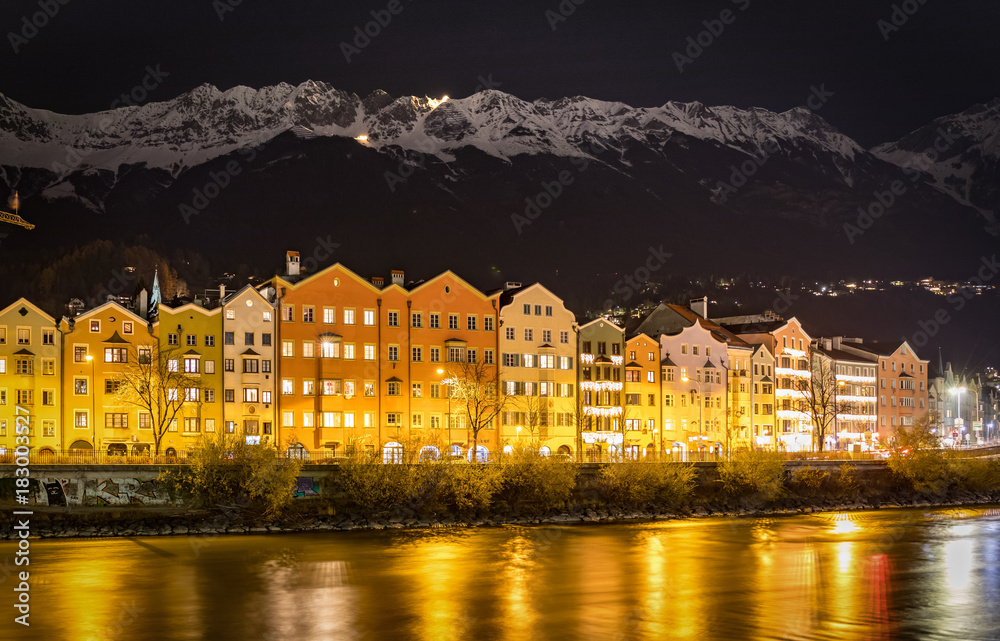 View to Innsbruck with snowy peaks at night