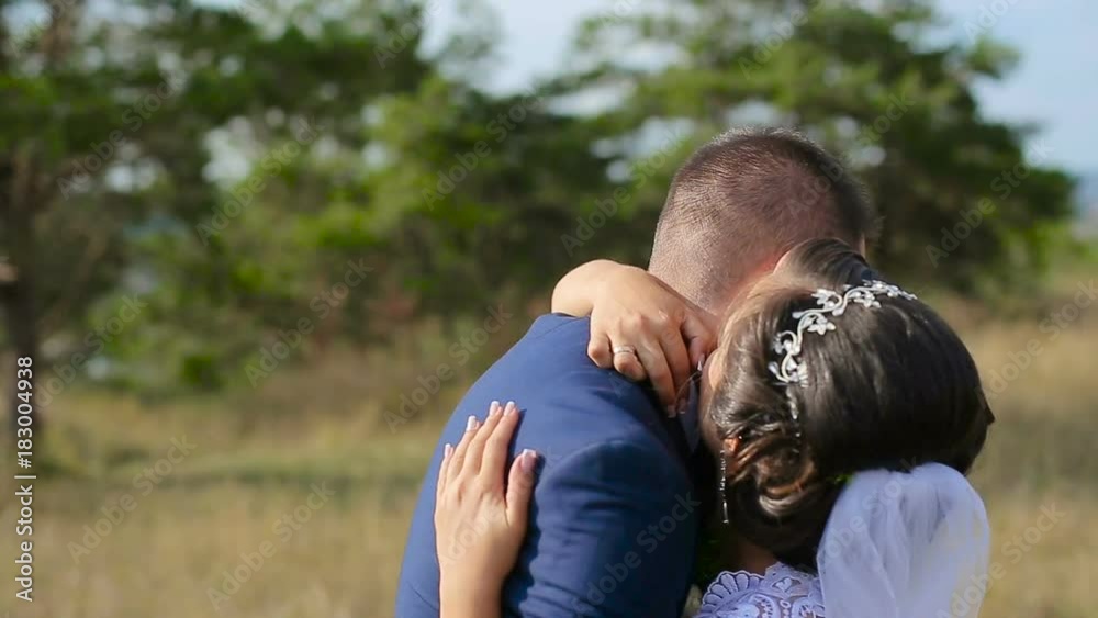 The bride leads the groom by the hand and laughs The bride leads the groom by the hand and laughs