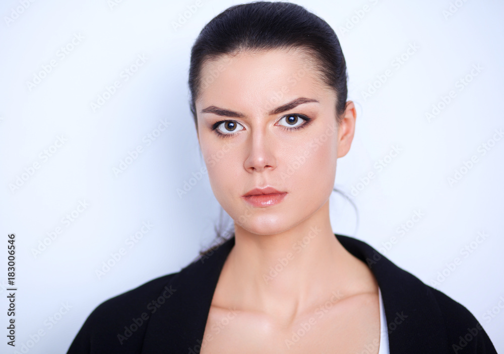 Young woman standing, isolated on gray background Young woman standing, isolated on gray background