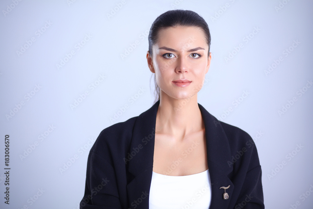 Young woman standing, isolated on gray background Young woman standing, isolated on gray background