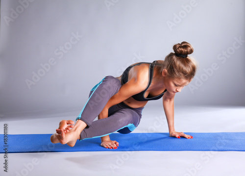 Portrait of sport girl doing yoga stretching exercise . yoga