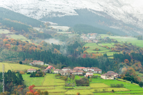 rural village of basque country on foggy day, Spain