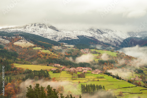 rural village of basque country on foggy day, Spain