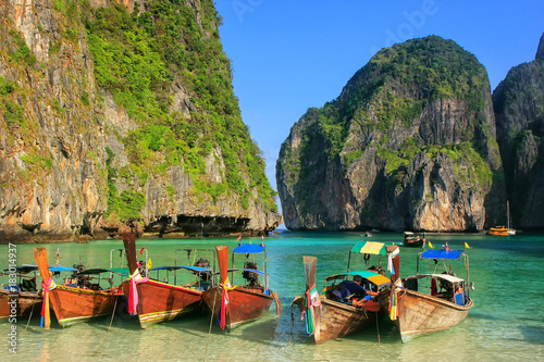 Longtail boats anchored at Maya Bay on Phi Phi Leh Island, Krabi Province, Thailand