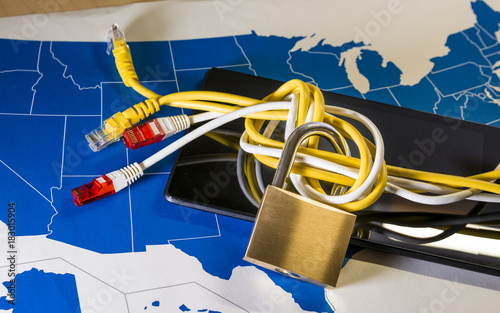 knotted net cable around a padlock over a US map photo