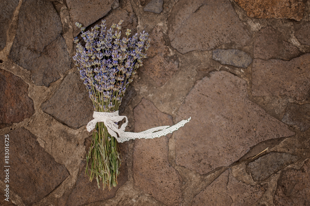 Fototapeta premium Beautiful and cute bouquet of lavender on the ground