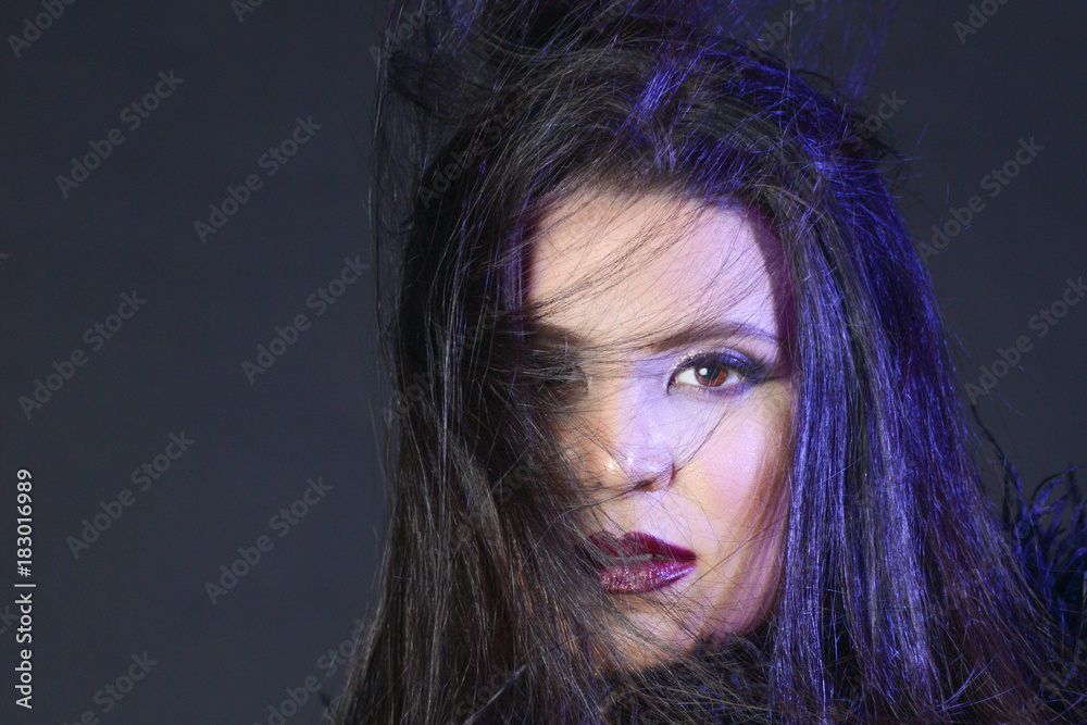 Ταπετσαρία Portrait of female model with purple light in windblown hair