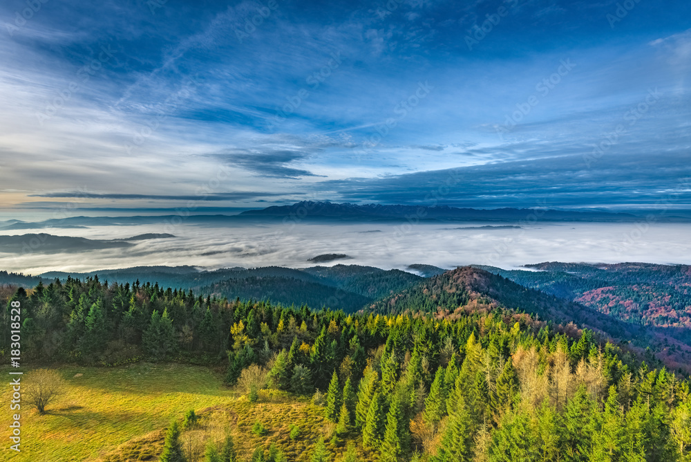 Misty sunrise landscape from Luban peak in Gorce mountains, Poland Misty sunrise landscape from Luban peak in Gorce mountains, Poland
