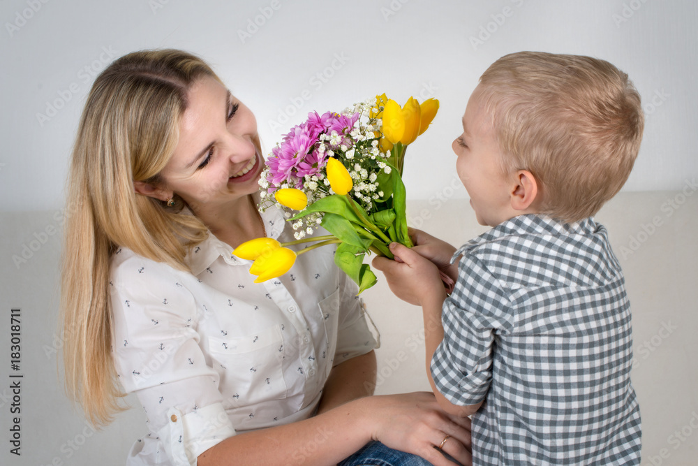 Son Gives His Beloved Mother A Beautiful Bouquet Of Tulipsthe Concept Of The Celebrationwomen