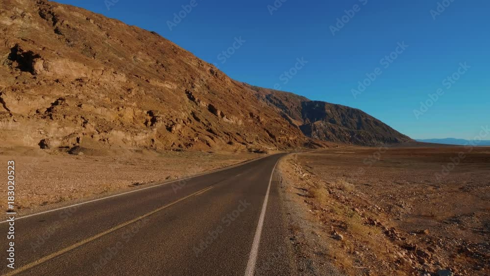 Scenery road through the amazing landscape of Death Valley National Park California Scenery road through the amazing landscape of Death Valley National Park California