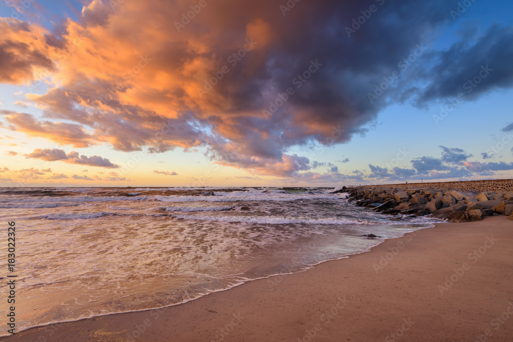 Scenic colorful sunset with amazing clouds over the Baltic sea. Poland.