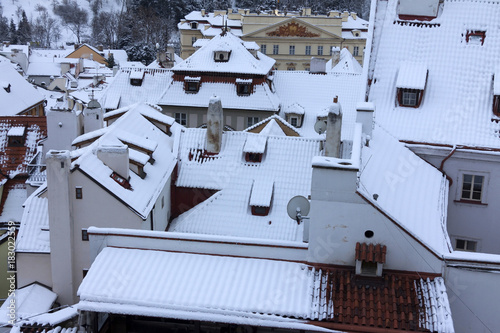 The Look on the snowy Roofs of the old gothic Town Prague © Kajano