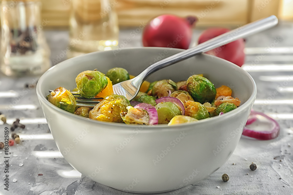 Bowl with yummy brussel sprouts on table Bowl with yummy brussel sprouts on table