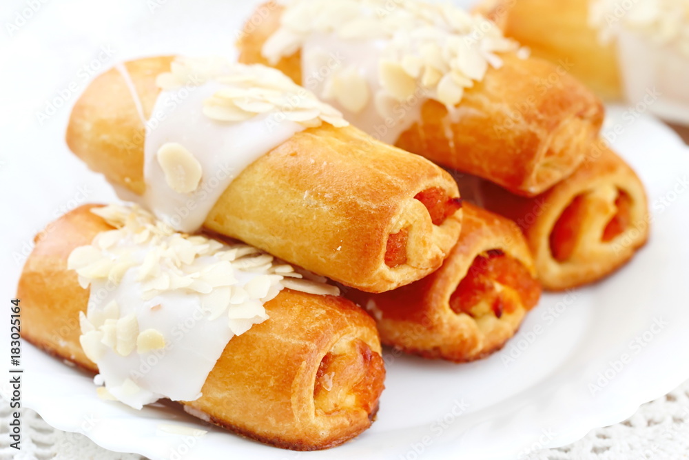 Roll with sweet cream, almonds and apricot jam Roll with sweet cream, almonds and apricot jam