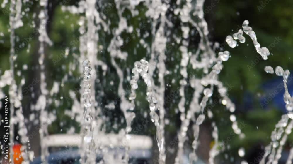 Water jet slow motion. Water drops and splashes fly in an air. City park fountain working, slow mo footage. Water jet slow motion. Water drops and splashes fly in an air. City park fountain working, slow mo footage.