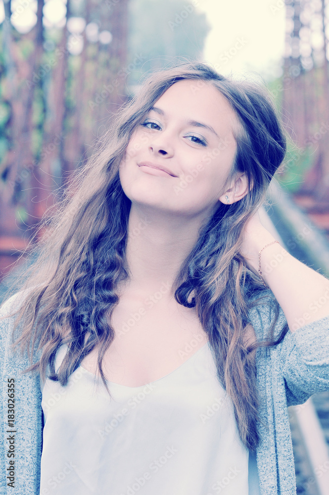 Fototapeta premium girl teenager smiling with her brown hair