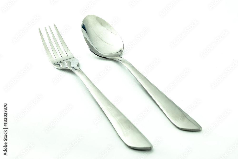 fork spoon placed Isolated on a white background. To use design work fork spoon placed Isolated on a white background. To use design work