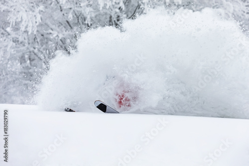A skier is in the deep snow. © Taras