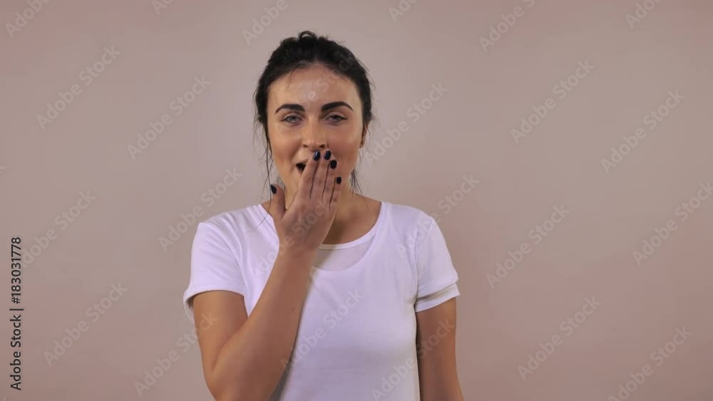 forworn caucasian woman with black hair yawns Portrait exhausted young girl wearing casual white t-shirt forworn caucasian woman with black hair yawns Portrait exhausted young girl wearing casual white t-shirt