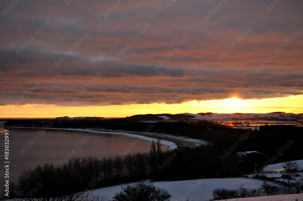 Sonnenuntergang im Winter über Mönchgut, Göhren und Groß Zicker