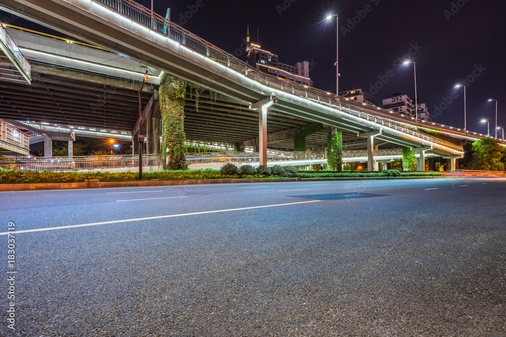 Empty road surface floor with city overpass viaduct bridge Empty road surface floor with city overpass viaduct bridge