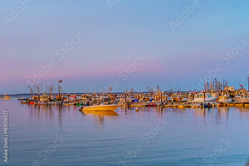 Ships and boats in the Provincetown Marina during sunset Provincetown, MA photo