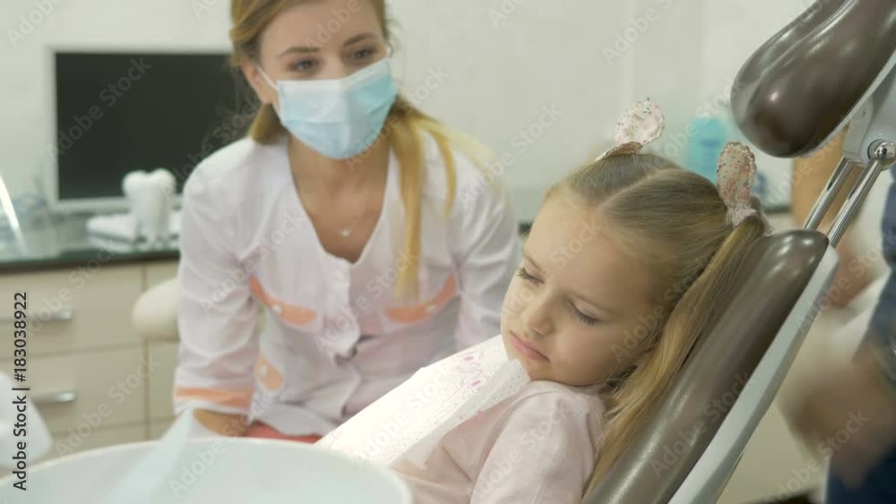 A little girl is capricious in the dentist's office. A little girl is capricious in the dentist's office.