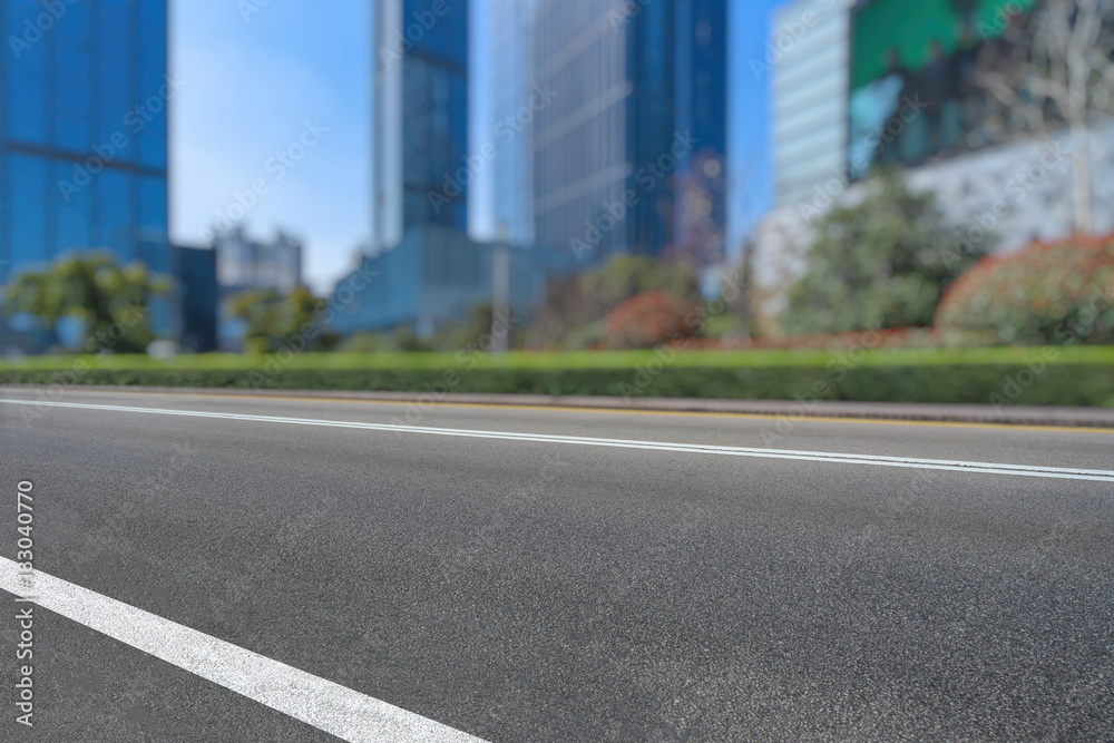 empty asphalt road front of modern buildings.