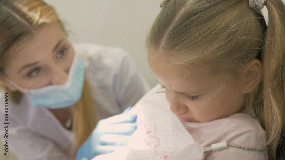 A little girl is capricious in the dentist's office. A little girl is capricious in the dentist's office.