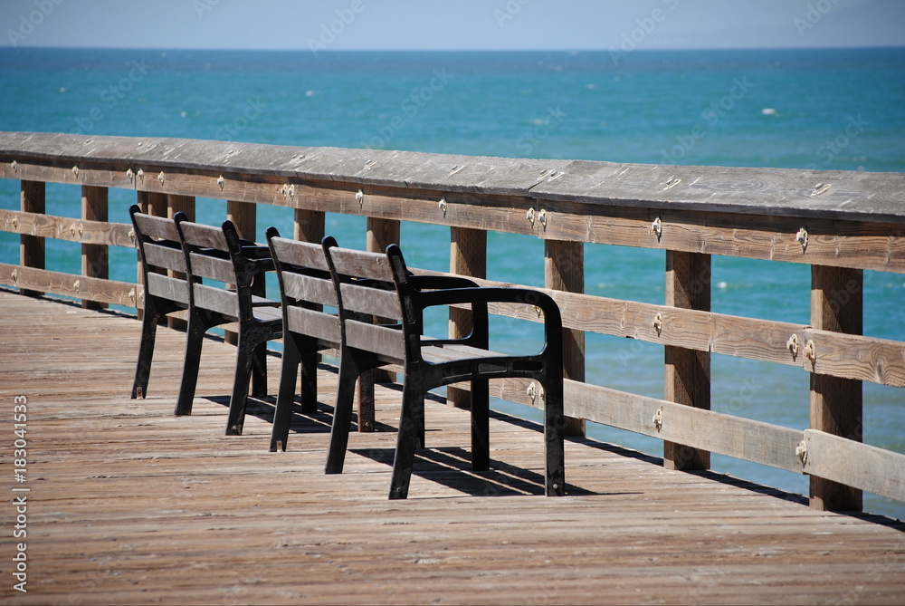 Benches in front of the ocean at Ventura Pier