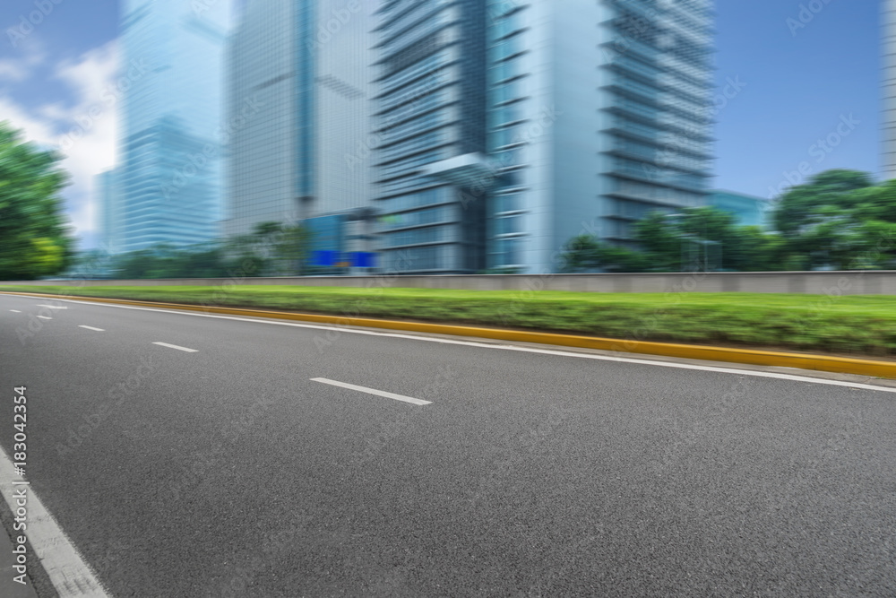 Empty urban road and modern skyline.