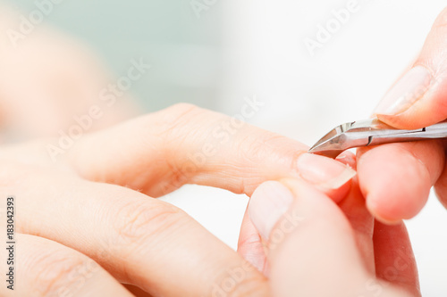 Preparing nails before manicure, cutting cuticles