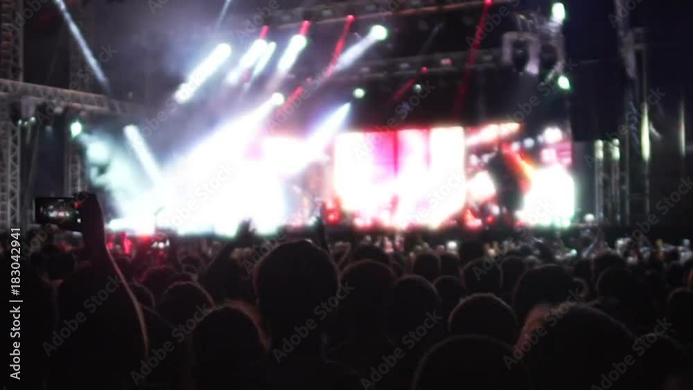 Bright illumination and powerful bass sound making adrenaline rush in crowd Bright illumination and powerful bass sound making adrenaline rush in crowd