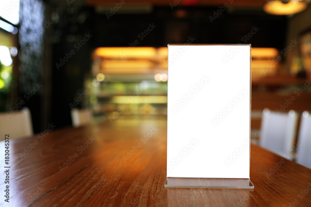 Mock up Menu frame standing on wood table in Bar restaurant cafe. space for text. Mock up Menu frame standing on wood table in Bar restaurant cafe. space for text.