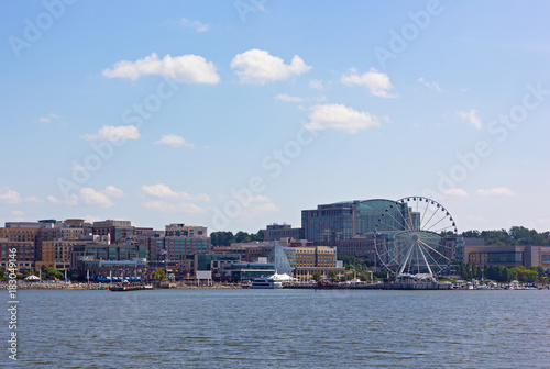 National Harbor waterfront panorama in Oxon Hill, Maryland, USA. Panorama of National Harbor with Ferris and modern buildings.
