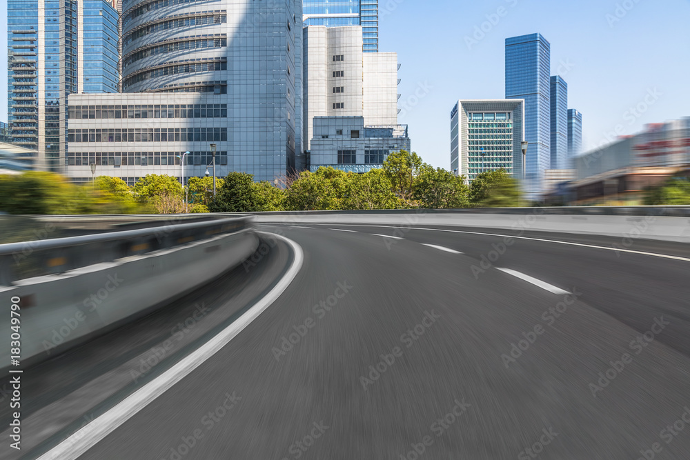 Elevated road front of modern buildings.