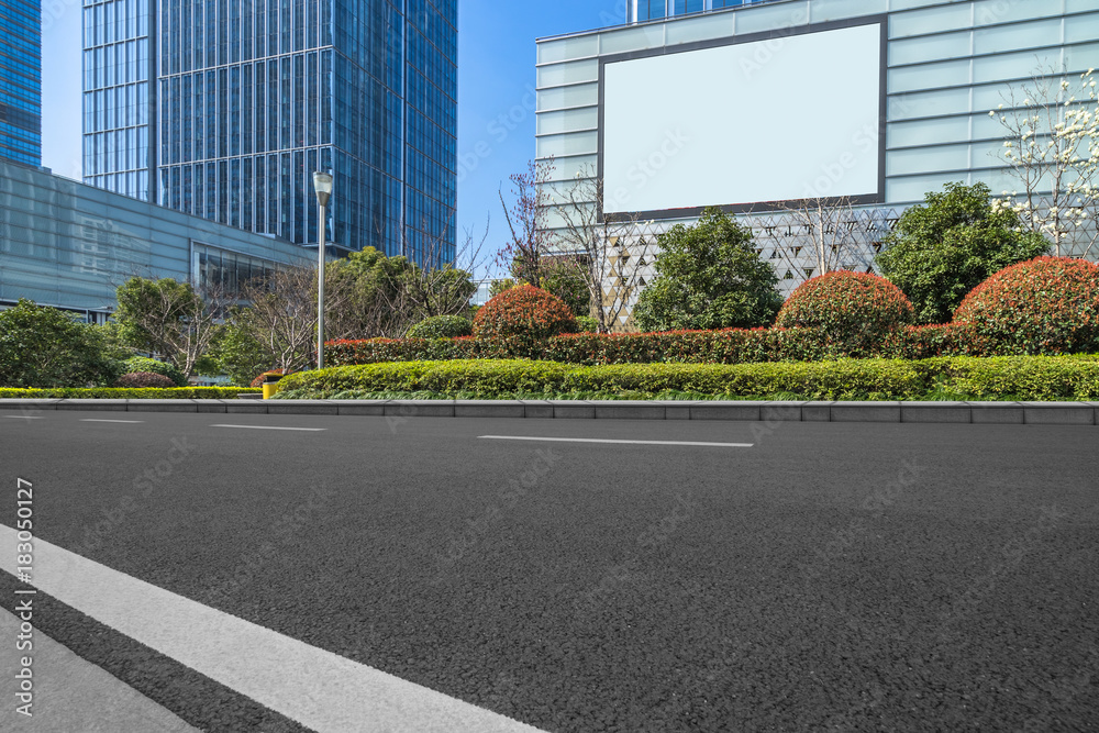 city empty traffic road with cityscape in background. city empty traffic road with cityscape in background.
