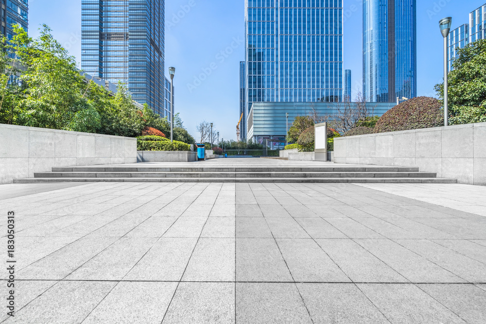 Fototapeta premium modern glass building exterior with empty pavement