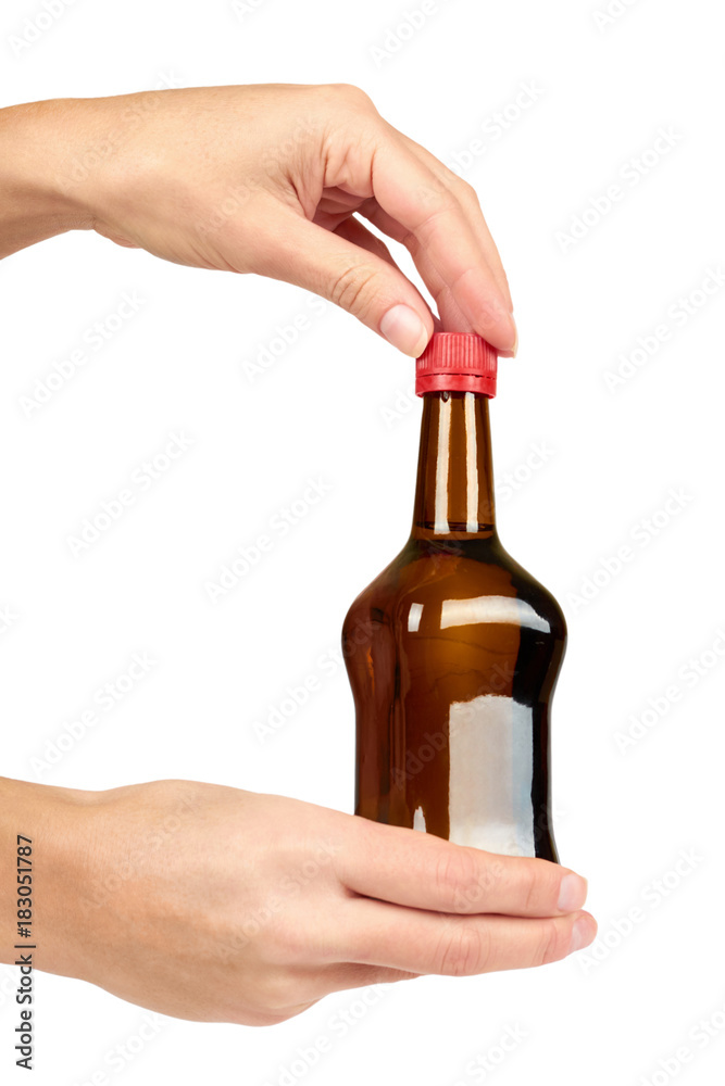 Glass bottle with soy sauce in hand isolated on white background. Asian food Glass bottle with soy sauce in hand isolated on white background. Asian food