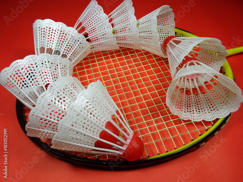 
colourfull plastic shuttlecocks  on badminton racket in colour  background. Photo taken in Malaysia, south east asia
