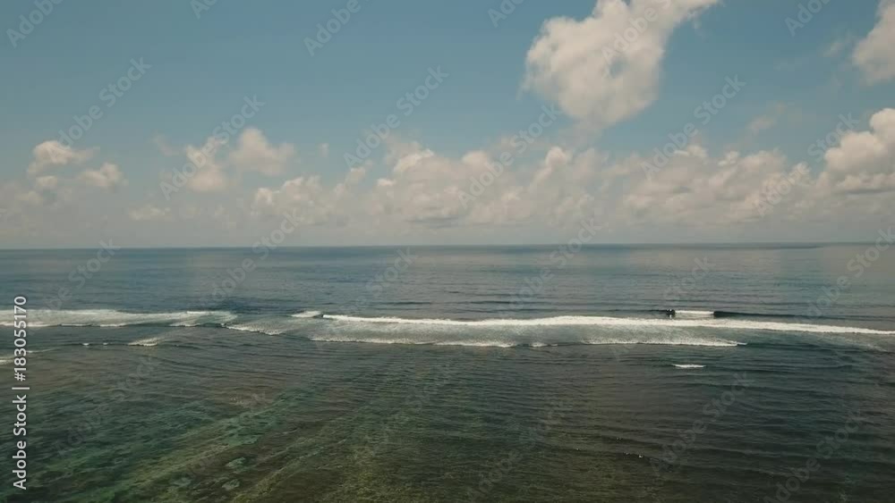 Aerial view: Sea water surface with waves. Flying over the blue ocean with blue water. Bali,Indonesia.4K video. Travel concept. Aerial footage Aerial view: Sea water surface with waves. Flying over the blue ocean with blue water. Bali,Indonesia.4K video. Travel concept. Aerial footage