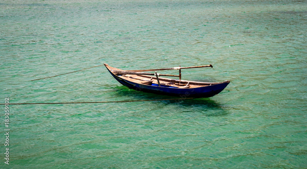 Simple bamboo boat on the sea