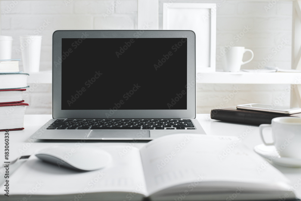 Fototapeta premium Hipster office workspace with empty laptop screen