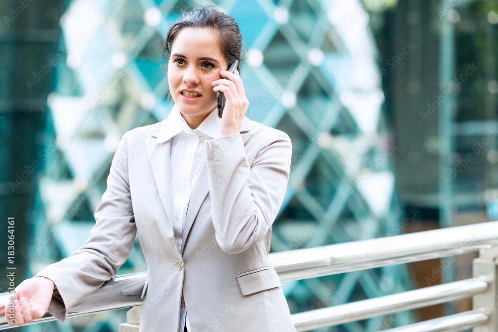 Portrait of business woman on phone.