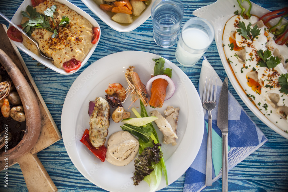 traditional mediterranean fish table and salad traditional mediterranean fish table and salad